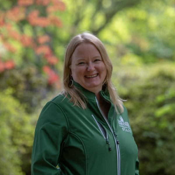 Woman standing in garden posing for a staff photo